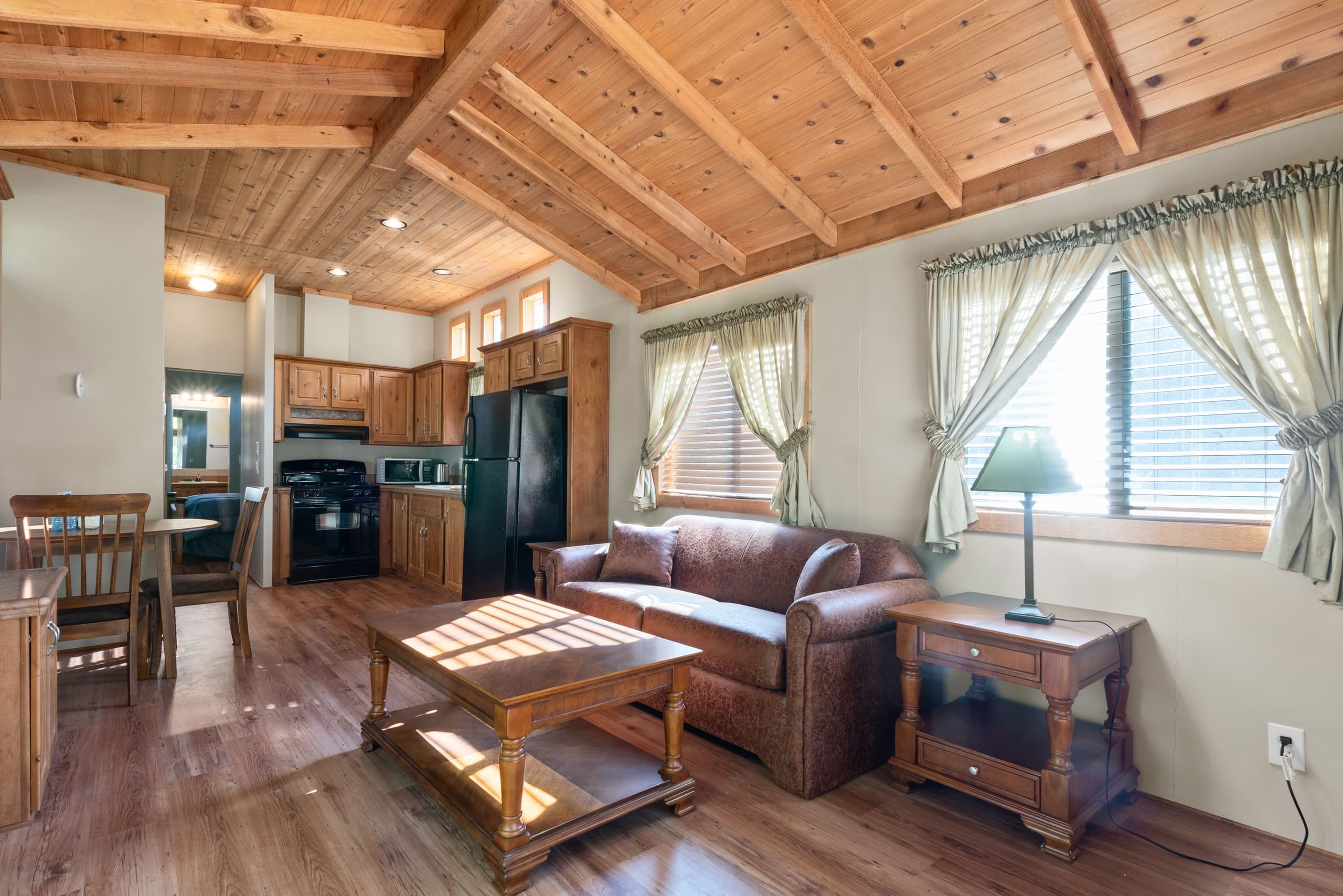 Cabin living room with leather sofa and coffee table