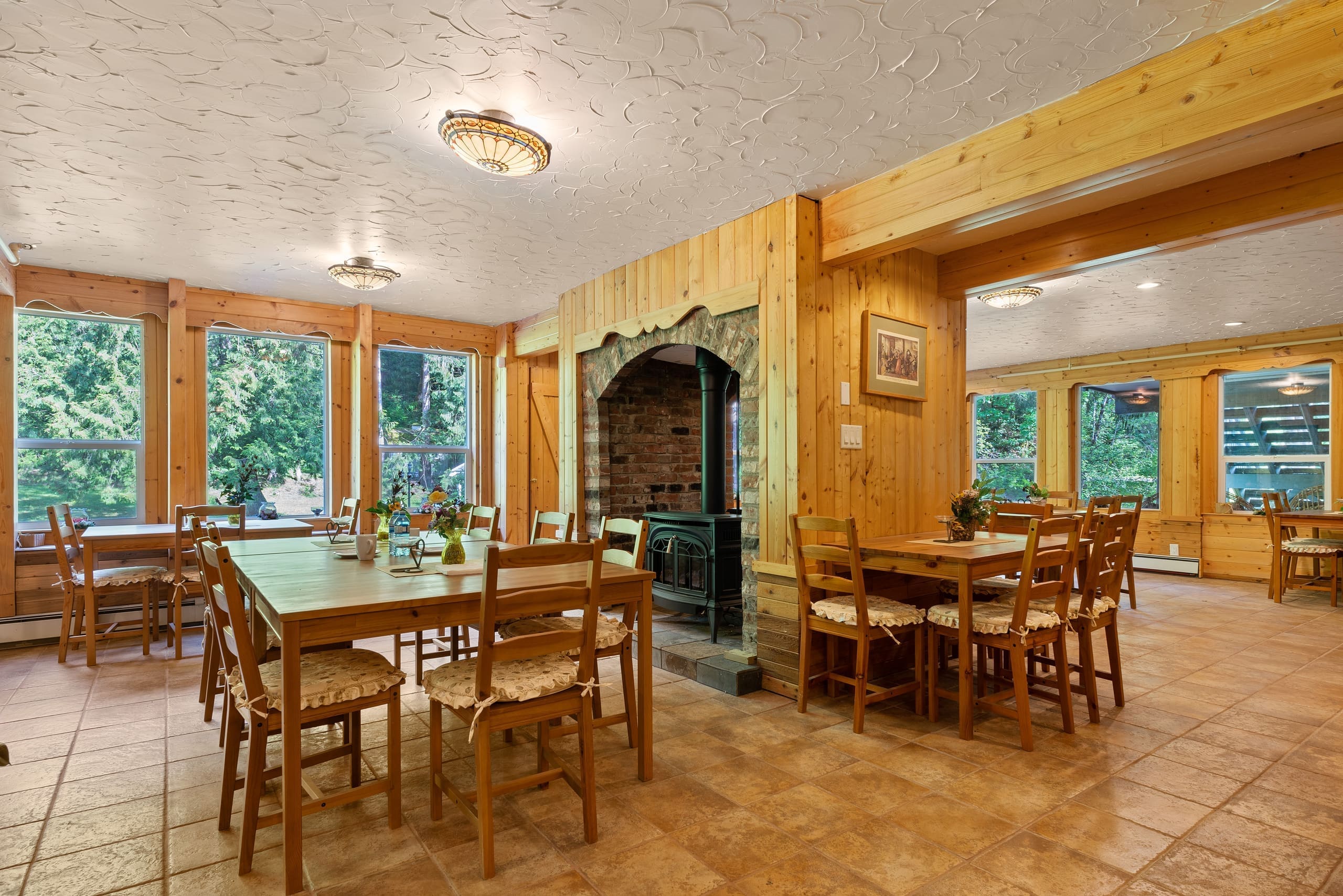 Dining room with brick hearth and wood stove